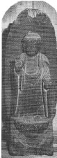 右手を前に出した木像を拡大して撮影した白黒の写真